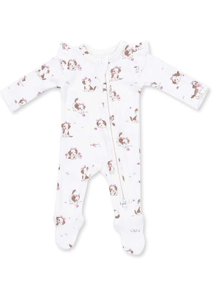 White baby onesie with a cute dog print and floral accents, featuring a front zipper and long sleeves.