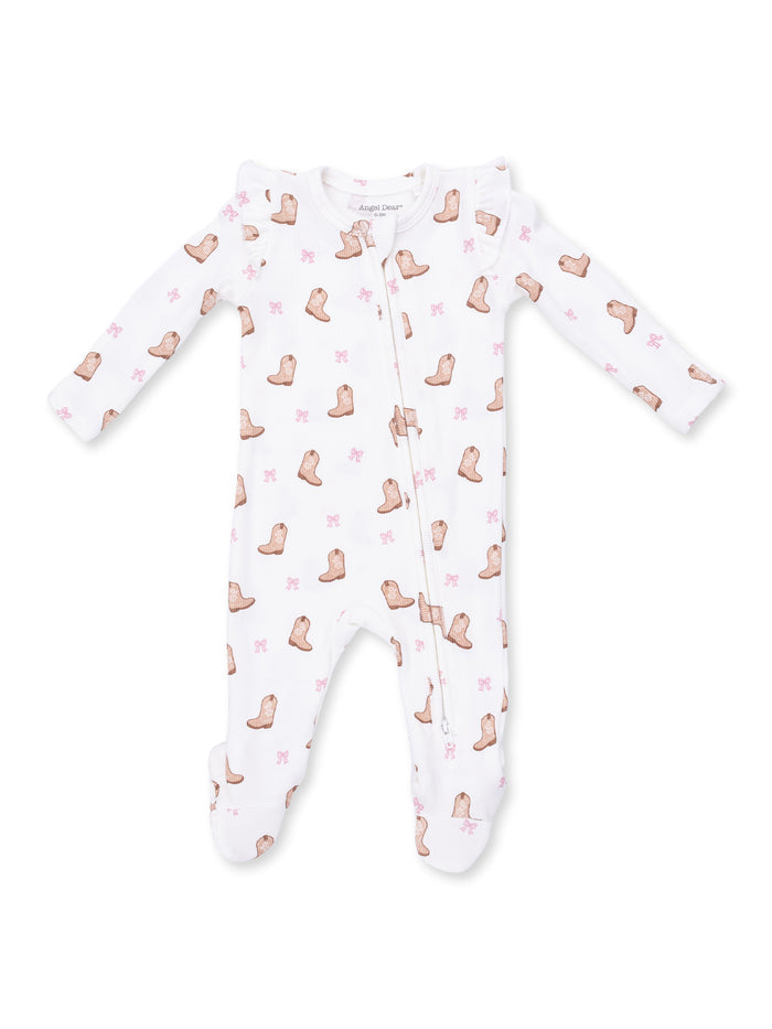 White baby onesie with boot and bow patterns, featuring zip closure and long sleeves.