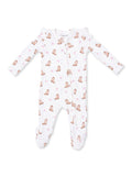 White baby onesie with boot and bow patterns, featuring zip closure and long sleeves.