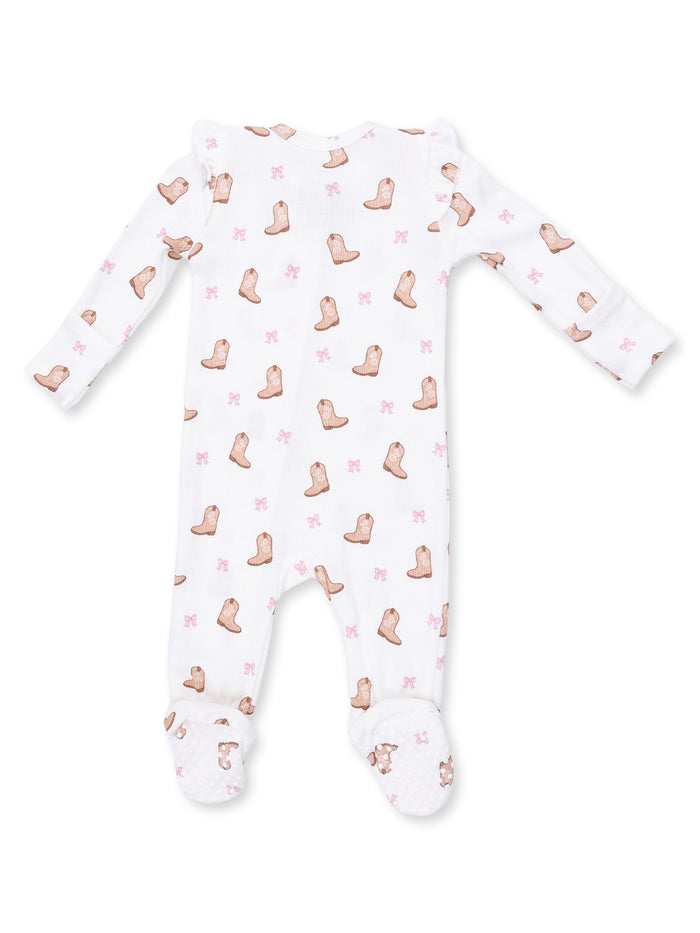 White infant onesie with boot and bow patterns, featuring long sleeves and footed design.