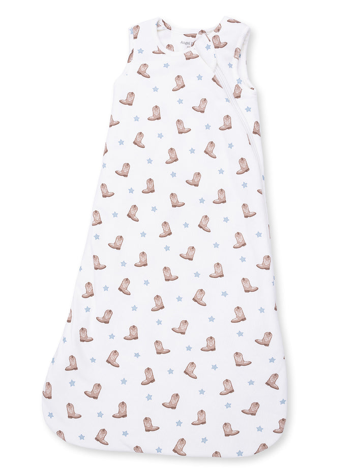 White sleeping bag with cowboy boot and star patterns for infants.