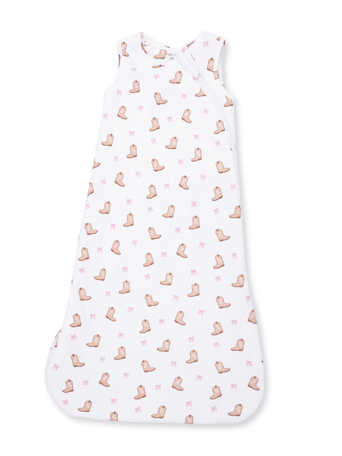 White baby sleep sack with a pattern of brown boots and pink bows. Soft and cozy for infants.