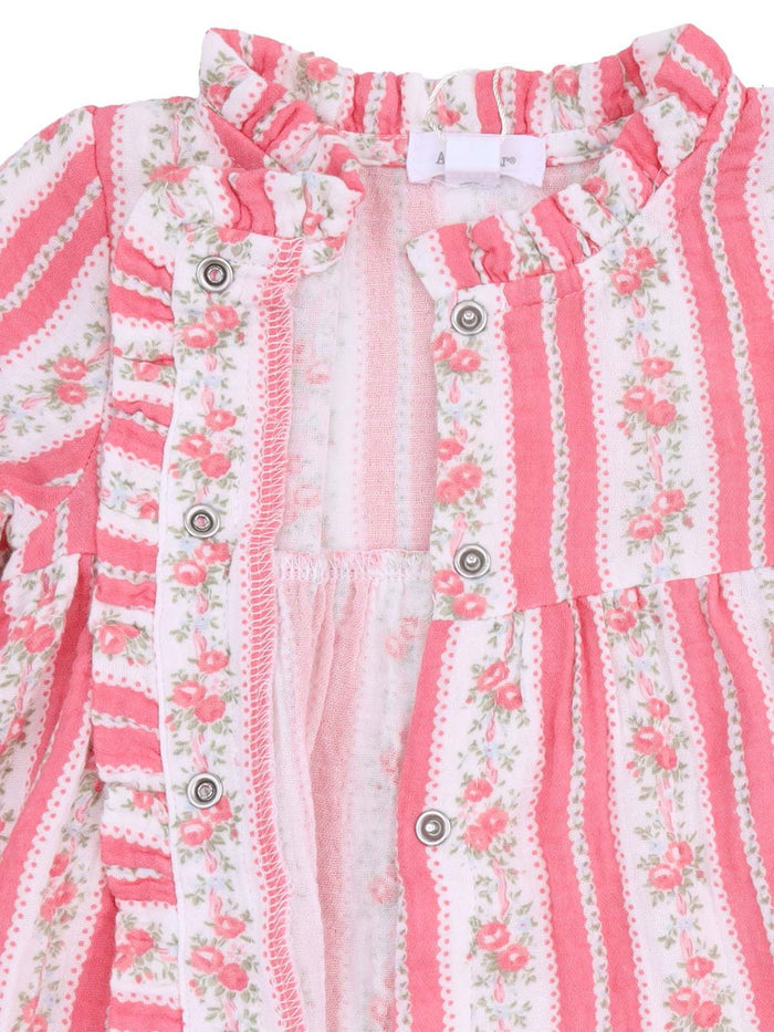 Pink striped dress with floral accents and ruffled neckline, featuring snap closures. Suitable for infants or toddlers.