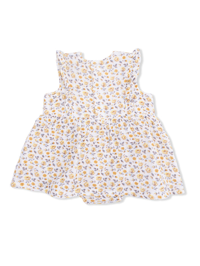 Floral-patterned white dress with ruffled sleeves and a gathered waist for girls.