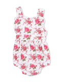 Floral baby romper in white with pink roses and green leaves, featuring wide straps and a gathered waistband.