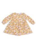 Floral patterned dress with long sleeves, featuring shades of orange, yellow, and pink on a light background.