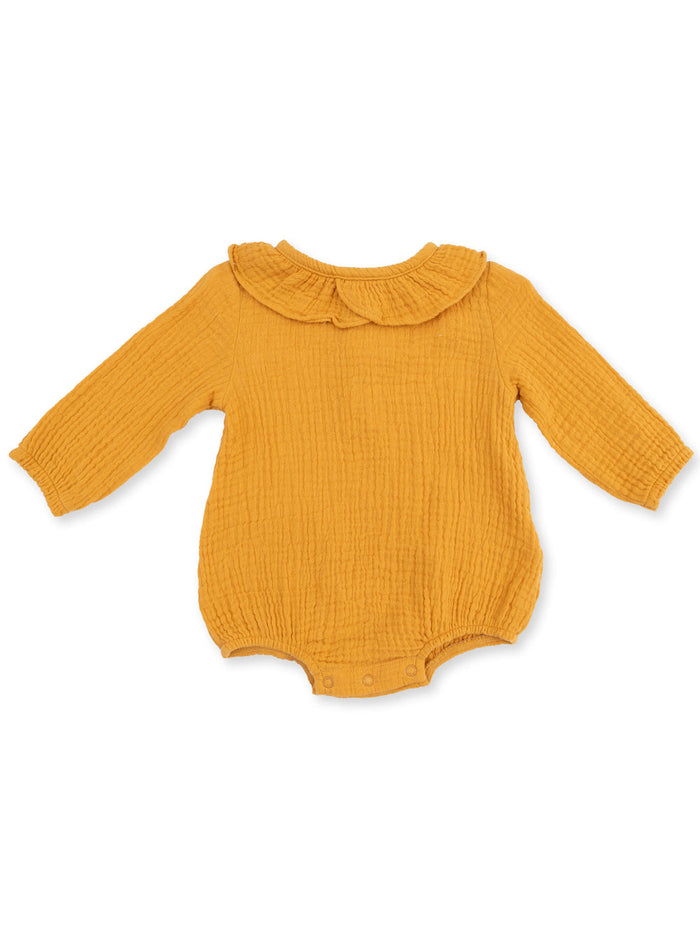 Mustard yellow baby bodysuit with long sleeves and a ruffled collar, featuring button closures at the bottom.