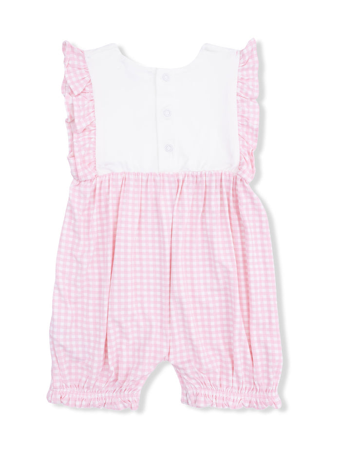 Pink gingham baby romper with white ruffle details and button closure at the back.