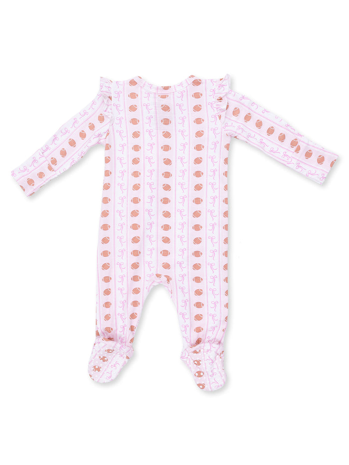 Pink infant romper with ruffled shoulders and patterned design of bows and acorns.