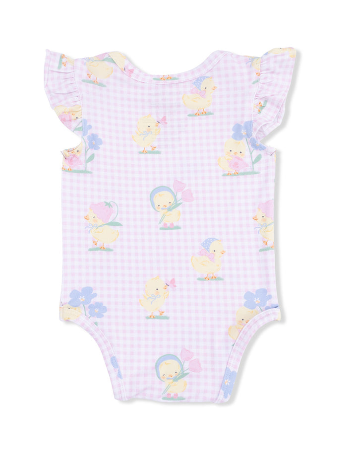 Light purple baby onesie with cute chick patterns and ruffled sleeves, set against a gingham background.