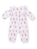 Light pink onesie with various dog prints, featuring long sleeves and ruffle details. Perfect for infants.