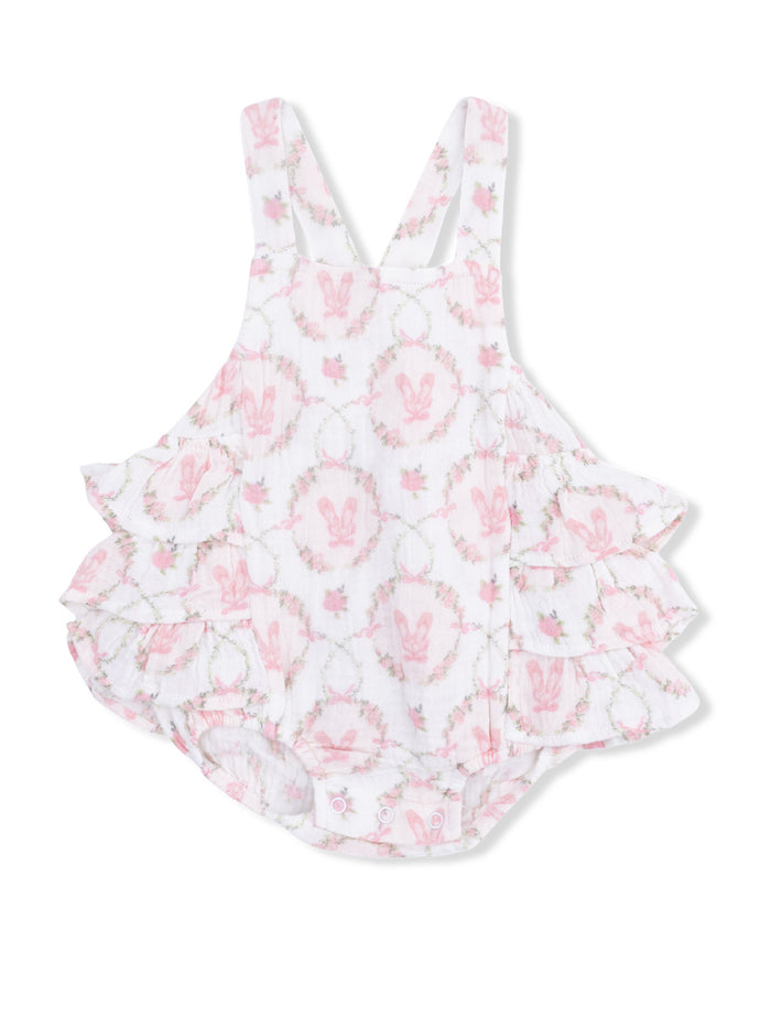 White baby romper with pink bunny pattern and frilled layers, ideal for spring or summer wear.