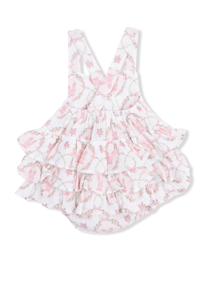 Pink floral ruffled romper with spaghetti straps for infants, featuring a delicate bunny pattern.