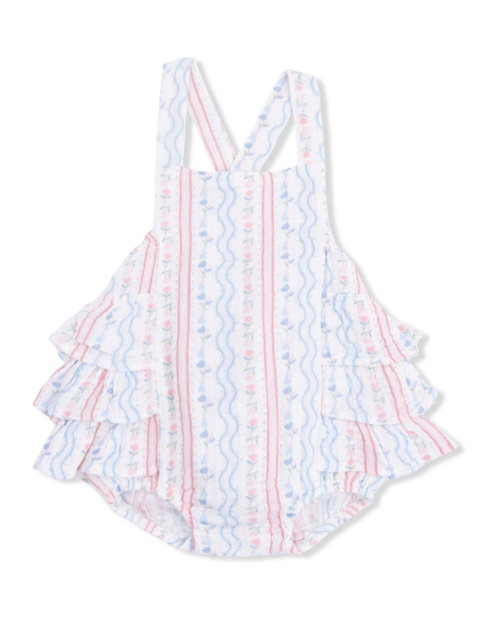 White ruffled one-piece swimsuit with pink and blue floral stripes. Ideal for children’s summer wear.