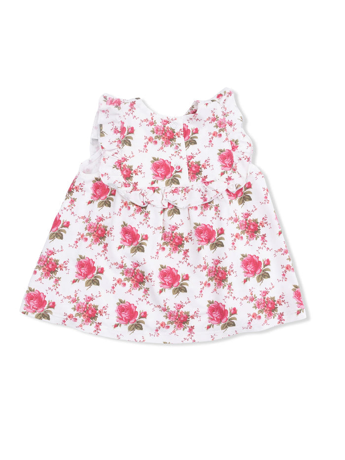 White floral dress with pink roses and ruffled neckline, suitable for children.