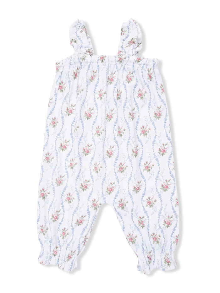 White floral romper with ruffled straps and elastic cuffs, featuring pink and blue flower patterns.