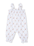 White floral romper with ruffled straps and elastic cuffs, featuring pink and blue flower patterns.