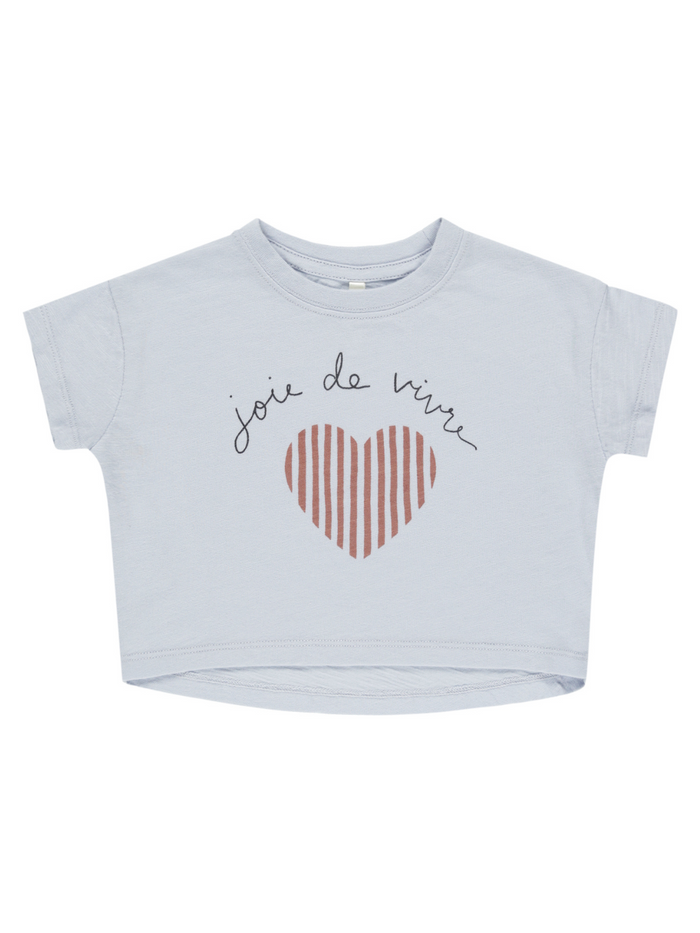 Light blue cropped t-shirt with "joie de vivre" and a striped heart graphic.