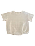 Cream striped infant shirt with short sleeves and snap closures at the bottom.