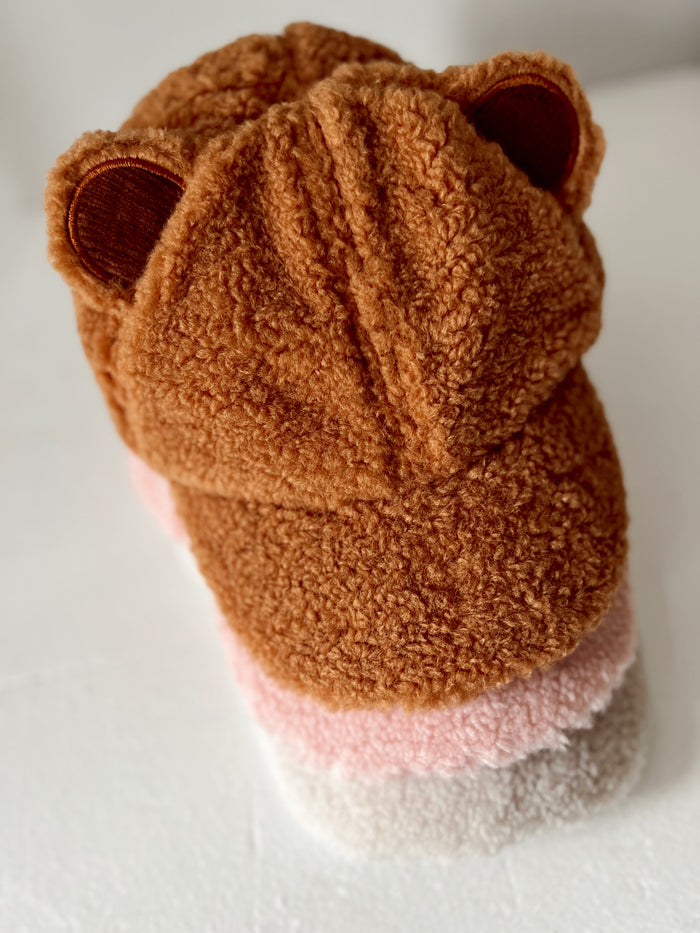 Cozy brown bear hoodie with ears, layered in soft pink and cream colors, perfect for warmth and style.