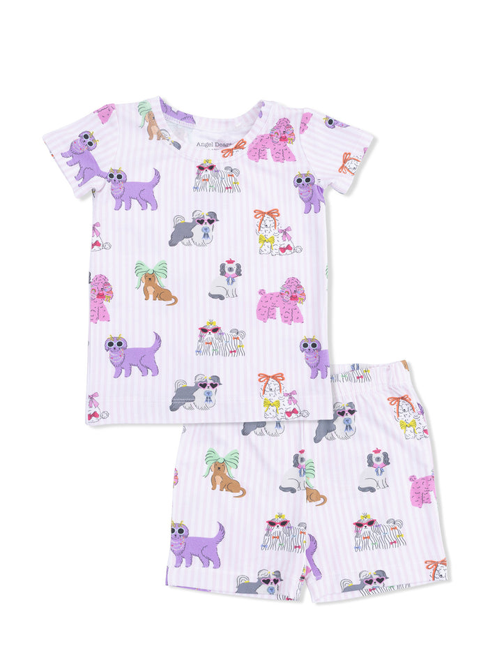 Kids' pajama set featuring colorful dog and cat illustrations on a light purple striped background.
