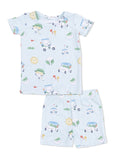 Light blue children's pajama set featuring playful cartoon characters, golf tees, and sun motifs.