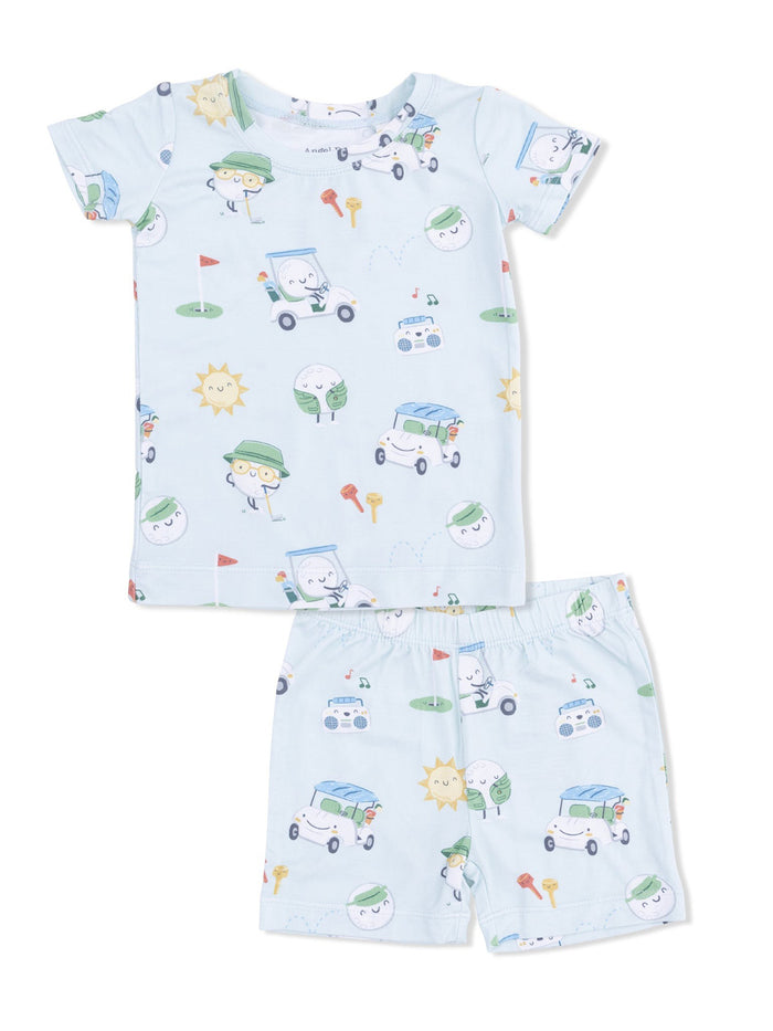 Light blue children's pajama set featuring playful cartoon characters, golf tees, and sun motifs.