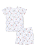 Floral-patterned children's pajama set, featuring a short-sleeve top and elastic waistband shorts.