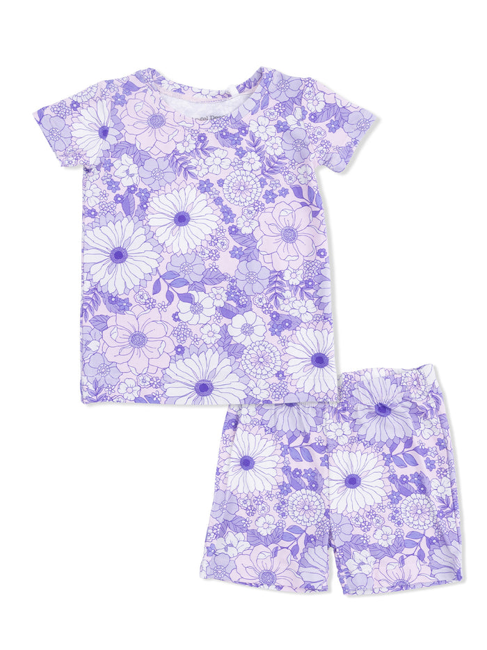 Purple floral pajama set featuring a short-sleeved top and matching shorts, perfect for kids' comfort.