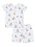 Children's pajama set featuring playful dog illustrations on a light background. Includes a shirt and shorts.