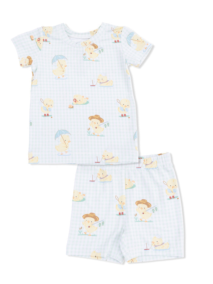 Baby pajamas set featuring playful duck illustrations on a light blue gingham background.