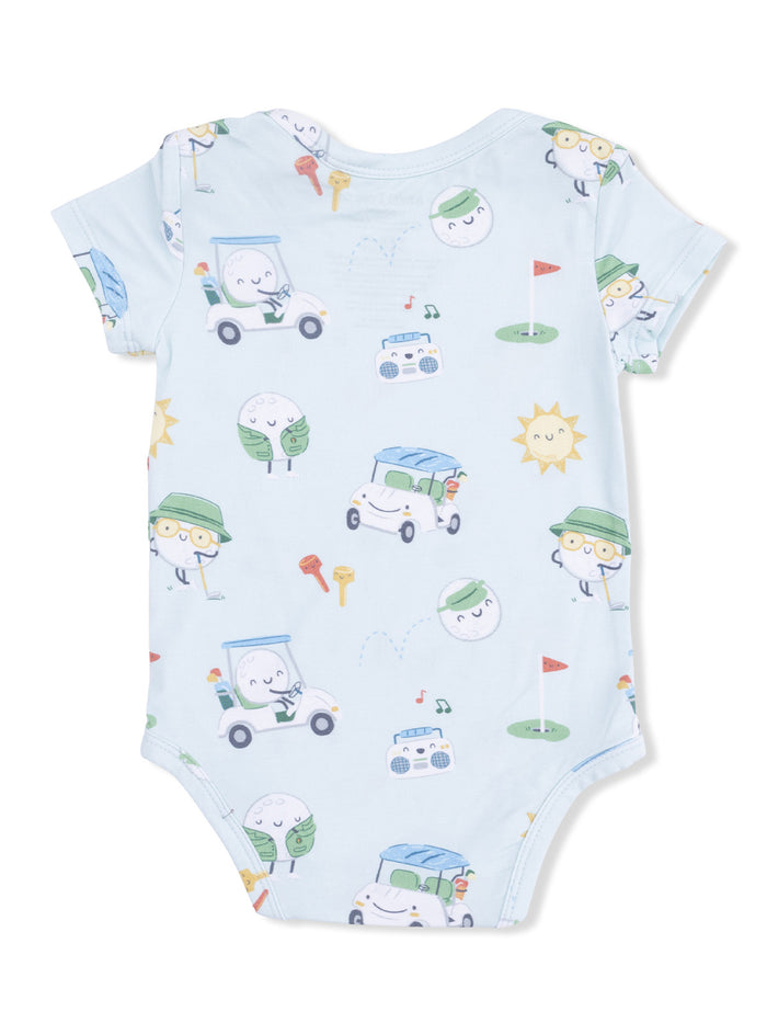 Light blue onesie featuring playful, cartoonish characters in cars, golf items, and cheerful sun illustrations.
