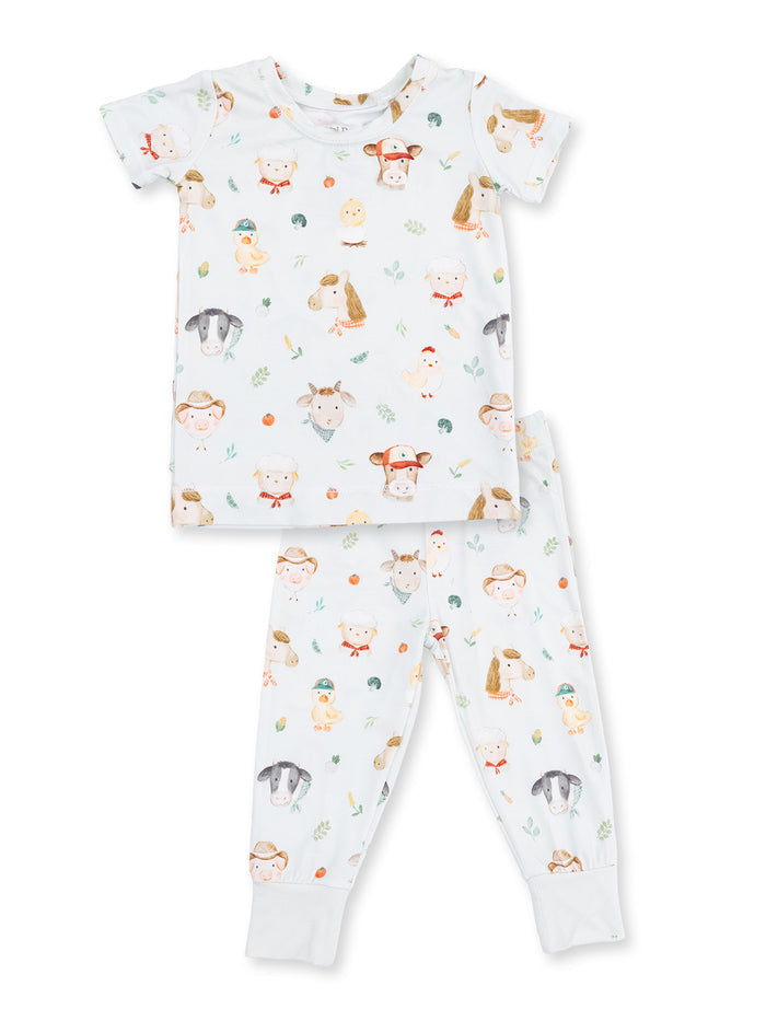 Child's pajamas featuring cute animal illustrations on a light background. Soft, comfy fabric for sleepwear.