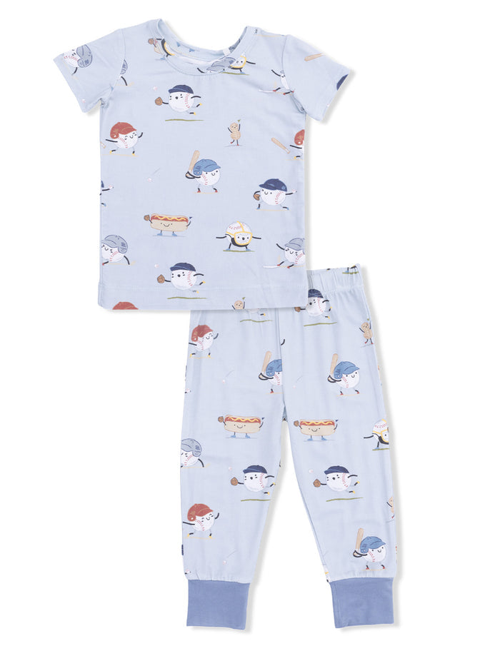 Light blue pajama set featuring playful food-themed characters, including hotdogs and ice cream, in cartoon style.