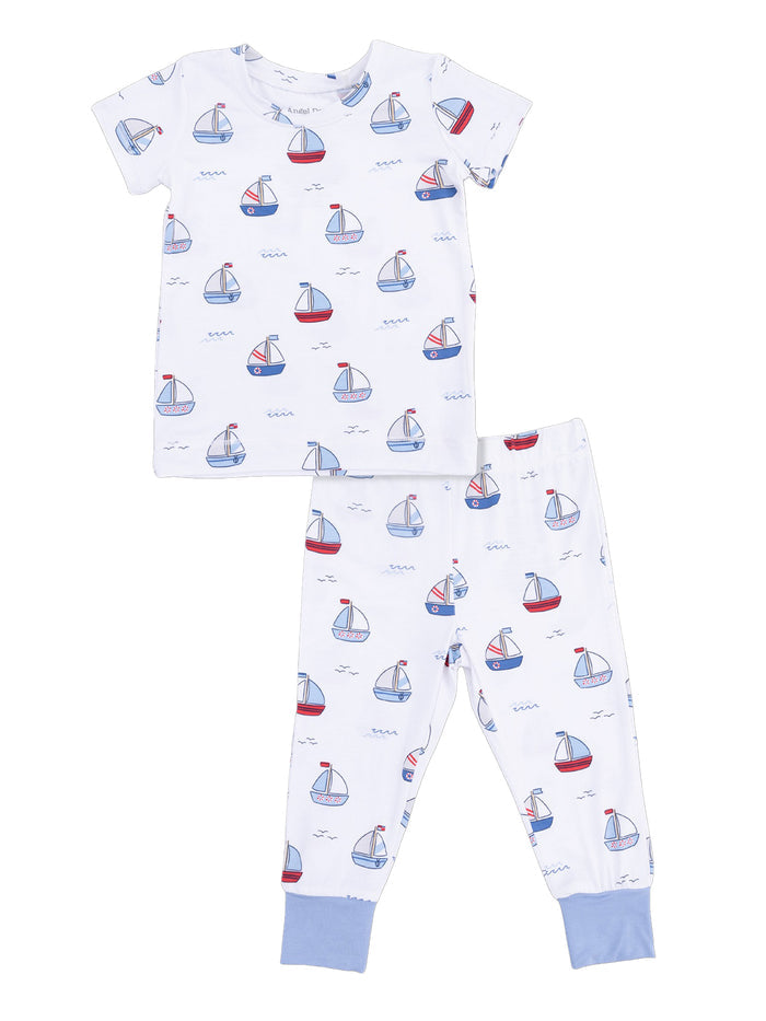 Child's cotton pajama set featuring a boat print with a short sleeve top and long pants. Ideal for cozy sleepwear.