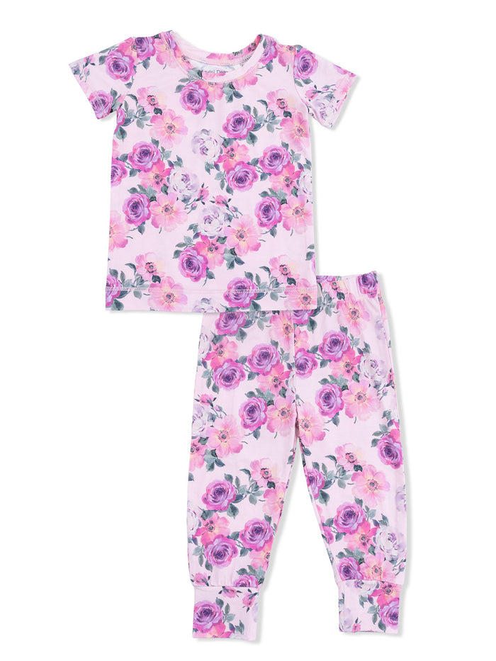 Floral pajama set with short-sleeve top and long pants in purple and pink hues on a light background.