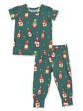 Kids' pajama set featuring a green background with colorful condiment bottle designs.