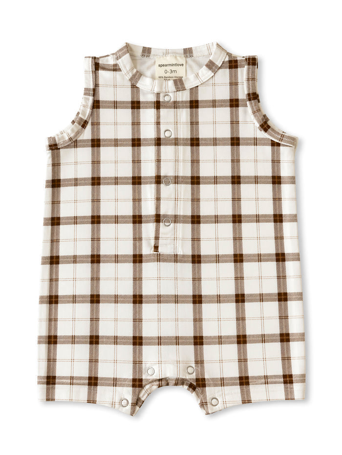 Infant sleeveless romper in a brown and white plaid pattern, featuring snap closures and a soft bamboo blend fabric.
