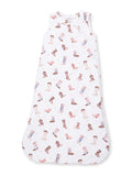 White baby sleeping sack with a playful cowboy boot pattern in soft pastel colors.
