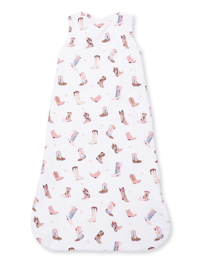White sleep sack with colorful cowboy boot patterns. Ideal for infants, offering comfort and style.