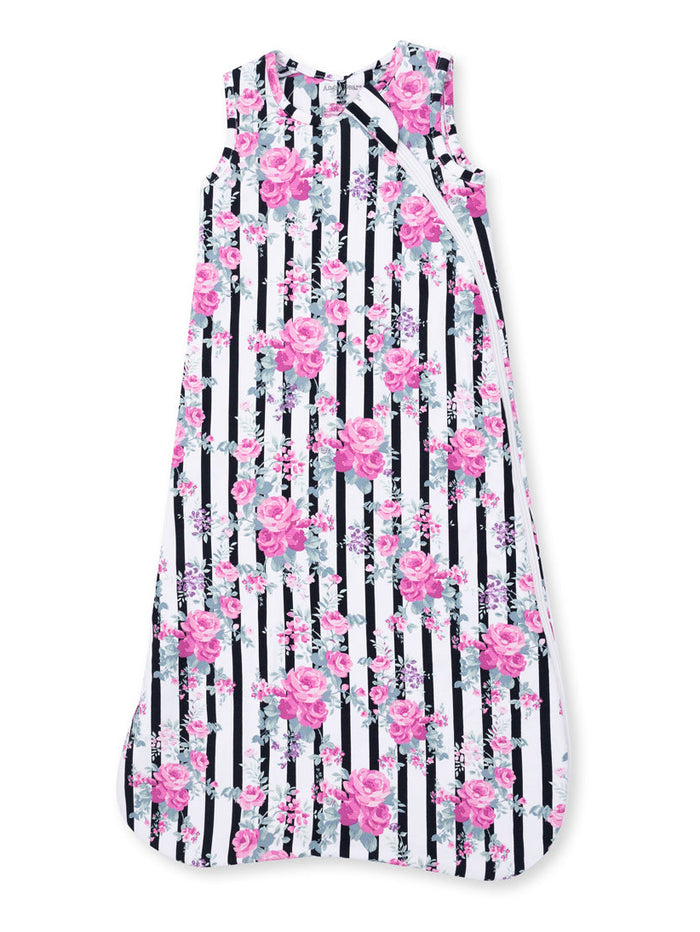 Floral sleeveless dress with pink roses and black-striped background. Ideal for casual summer wear.