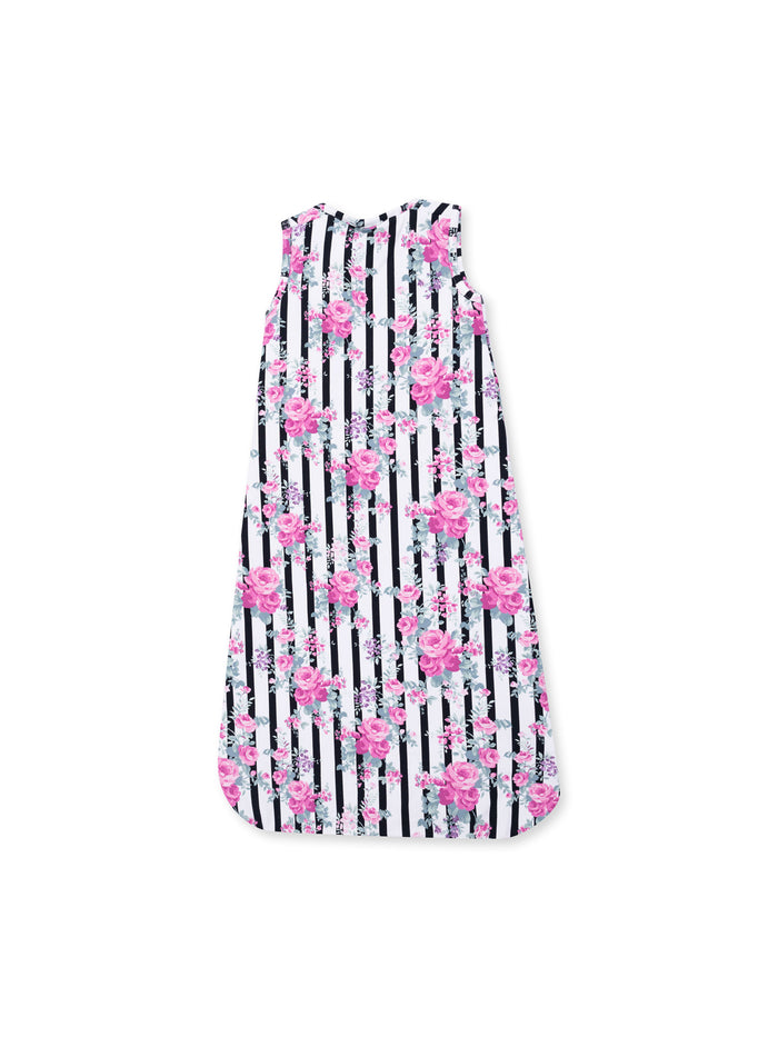 Floral dress with pink roses on black and white striped fabric, designed for a stylish summer look.