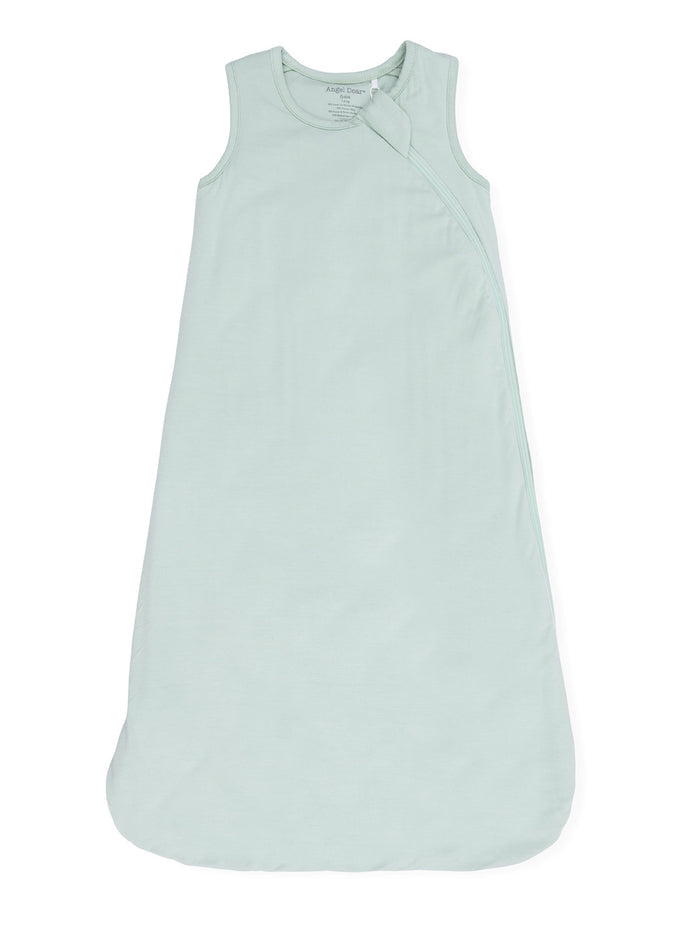 Light green baby sleep sack with sleeveless design and zipper closure. Soft material for comfort.