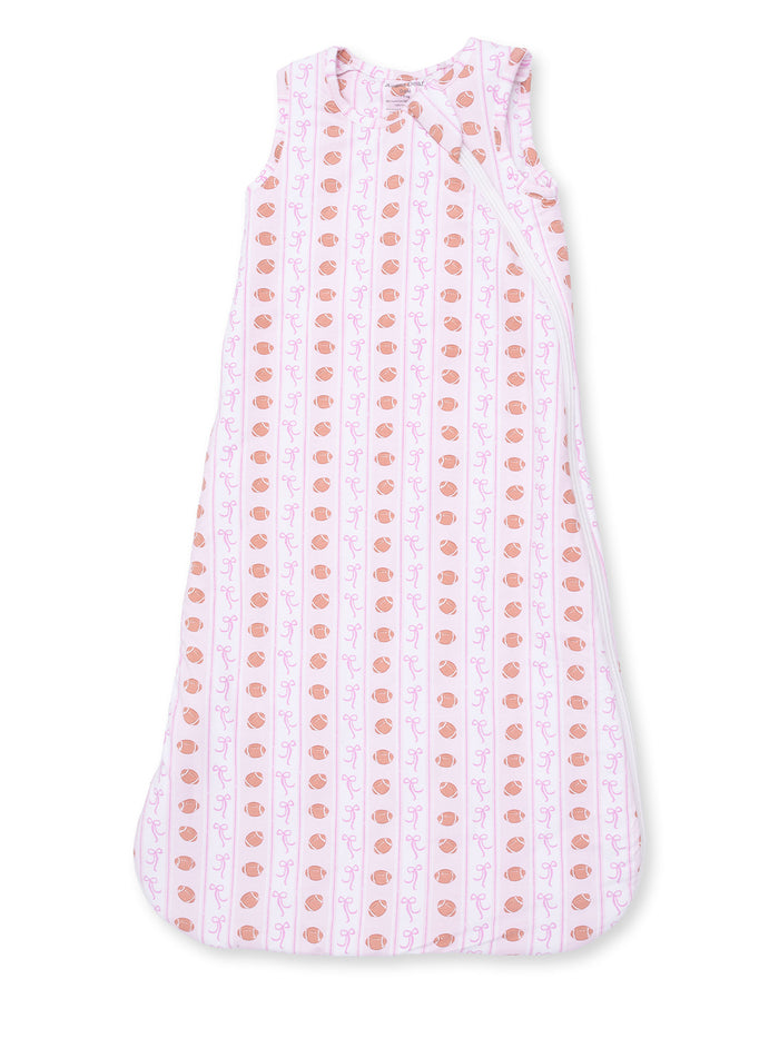 Light pink sleep sack with a pattern of cups and bows, perfect for infants and toddlers.