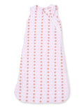 Light pink sleep sack with a pattern of cups and bows, perfect for infants and toddlers.