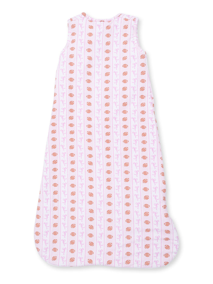 Light pink sleeping bag with cute patterns of orange cups and purple swirls, designed for infants.