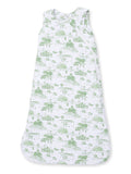 Lightweight white sleep sack with green nature-themed print, ideal for keeping babies warm and comfortable.