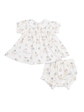 White baby dress with floral and animal prints, featuring a collar and matching bloomers.