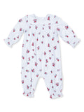White floral baby romper with long sleeves and button closure, featuring small red rose patterns throughout.