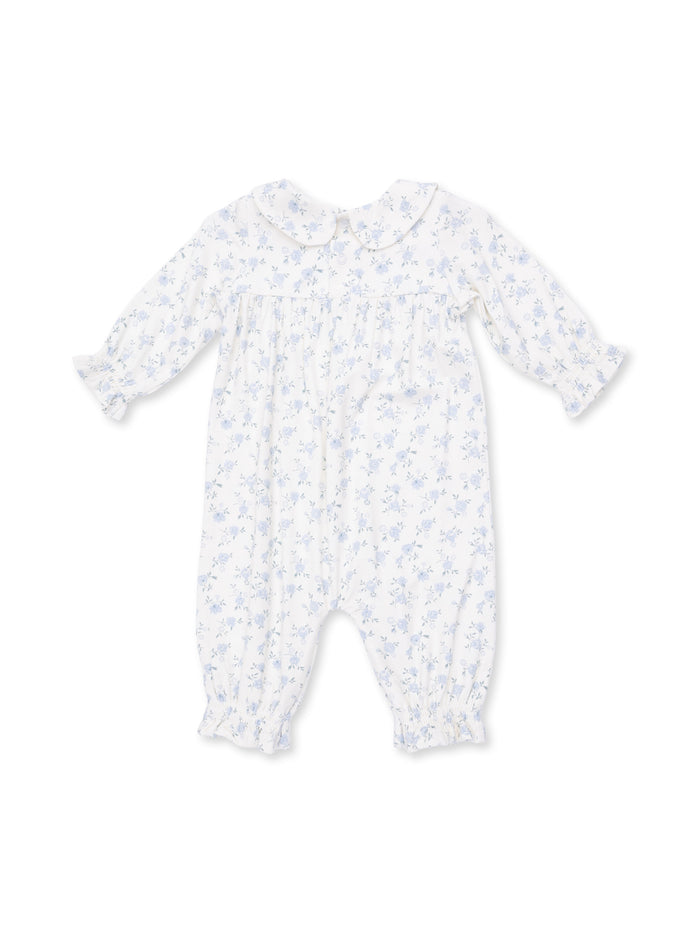 White baby romper with blue floral pattern and peter pan collar. Soft, long sleeves and elasticized cuffs.